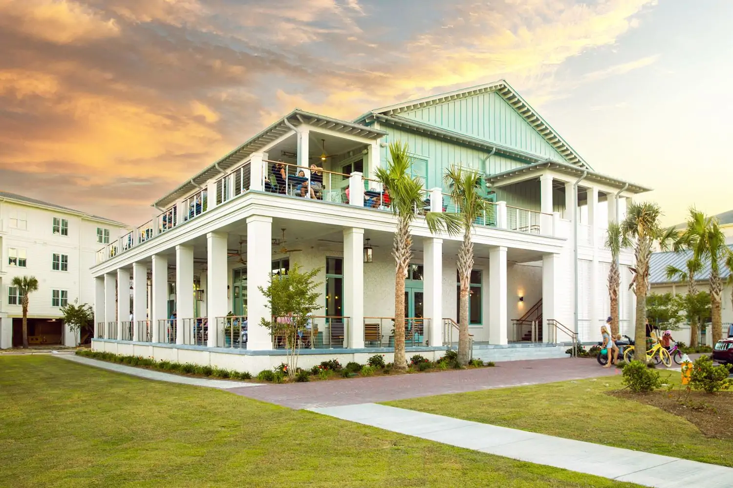 A two-story home with multiple verandas is the setting for The Kingstide in Charleston.