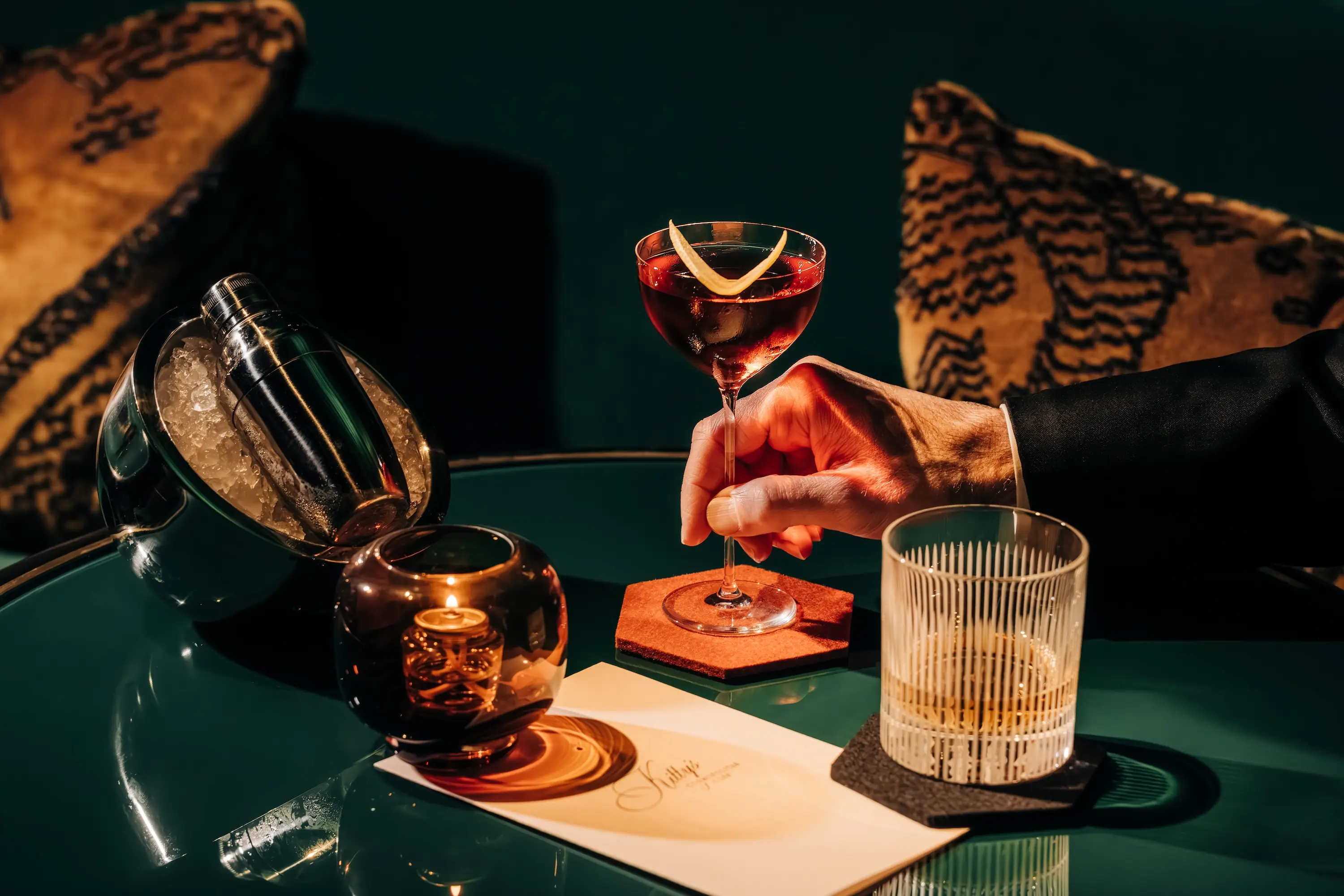 A bourbon cocktail with a lemon peel on top at Kitty’s Cosmopolitan Club in Chicago