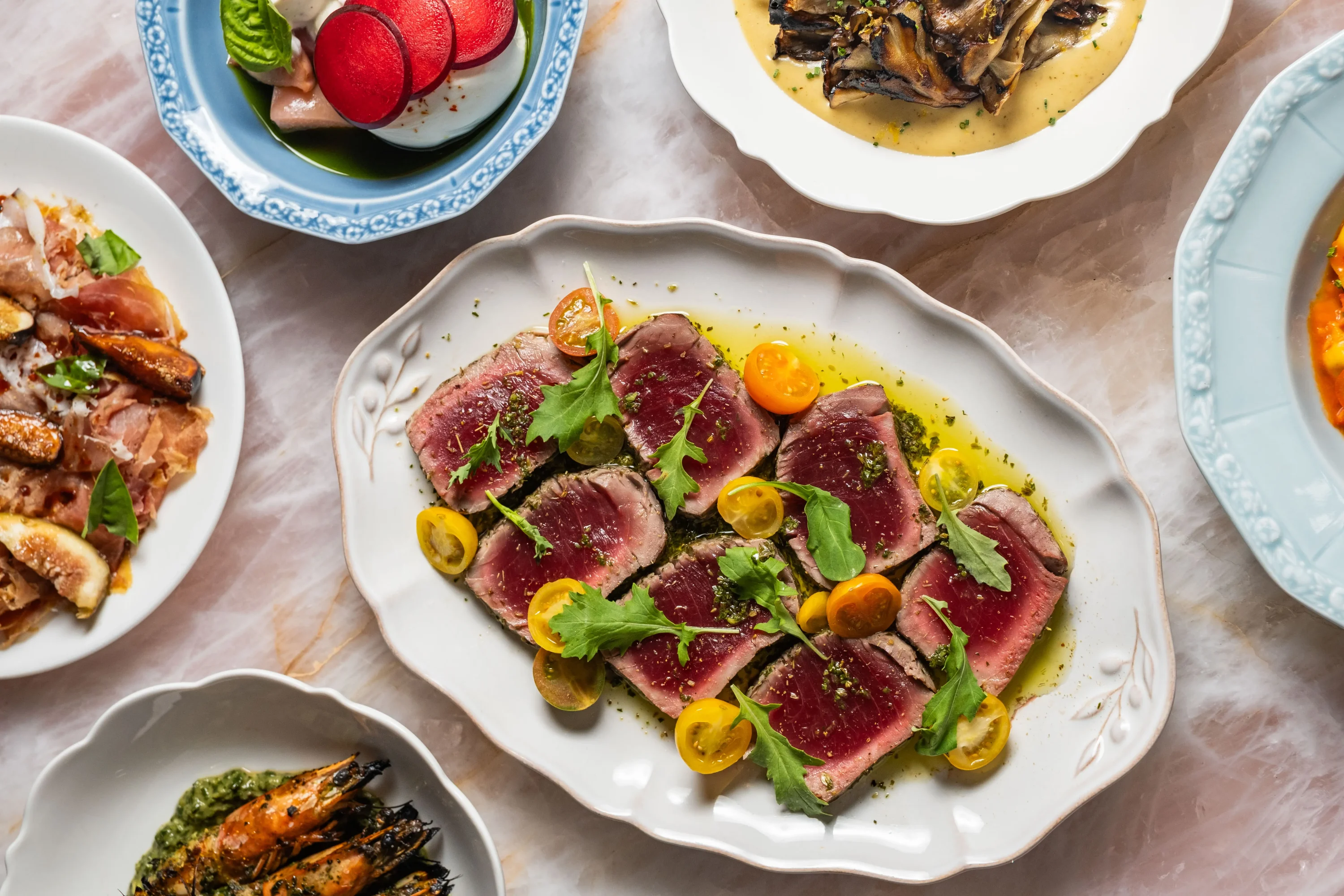 Seared and sliced bluefin tuna on a white plate at the restaurant Marisi in La Jolla