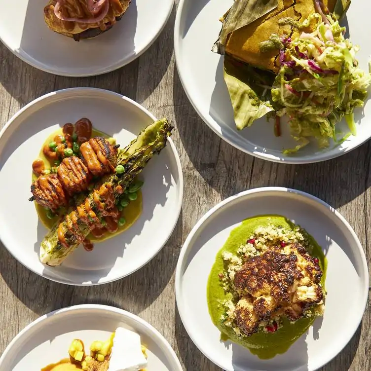 A spread of Japanican plant-based dishes at Jam Delish, one of the best restaurants in London for vegan food.